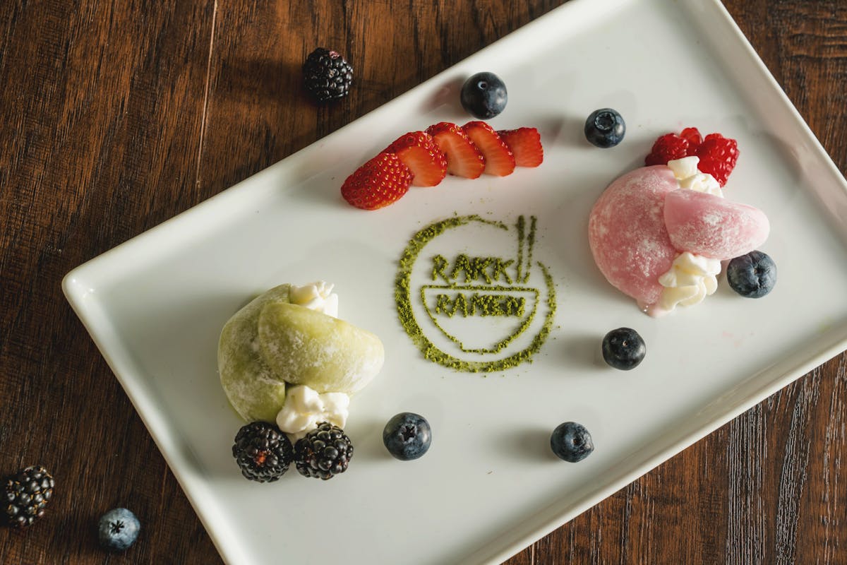 a plate of food with a slice of cake on a table